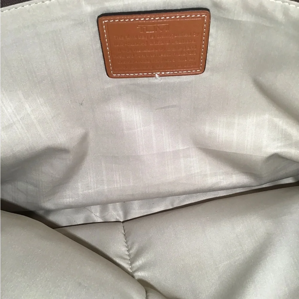 Tumi worn but